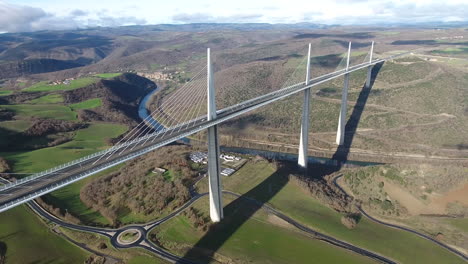 Flying-towards-Millau-Viaduct-over-river-Tarn-sunny-day.-Aerial-drone-shot